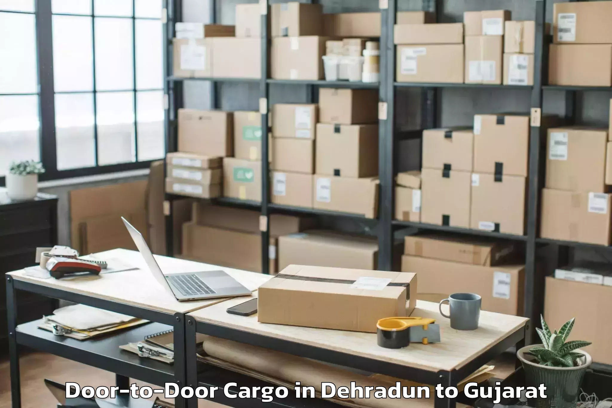 Affordable Dehradun to Lavad Door To Door Cargo